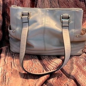 Beautiful leather tignanello bag to tone a light blush/light cream color used